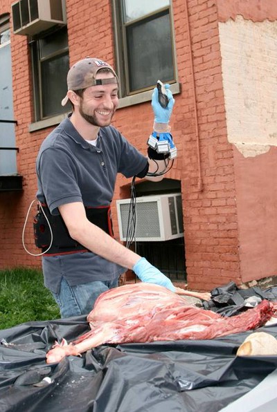 Andrew Zipkin and other members of the Human Functional Anatomy course studied the biomechanics of flake use during butchery by practicing on a goat carcass.
